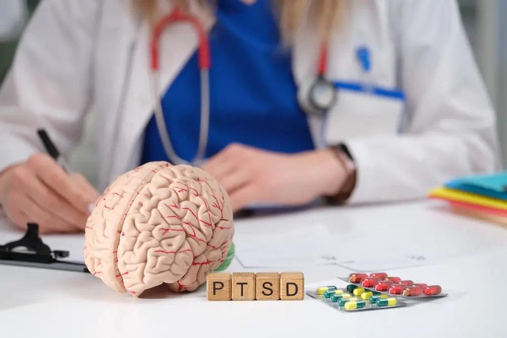 Brain MRI infographic showing hippocampus shrinkage and overactive amygdala in patients with PTSD.